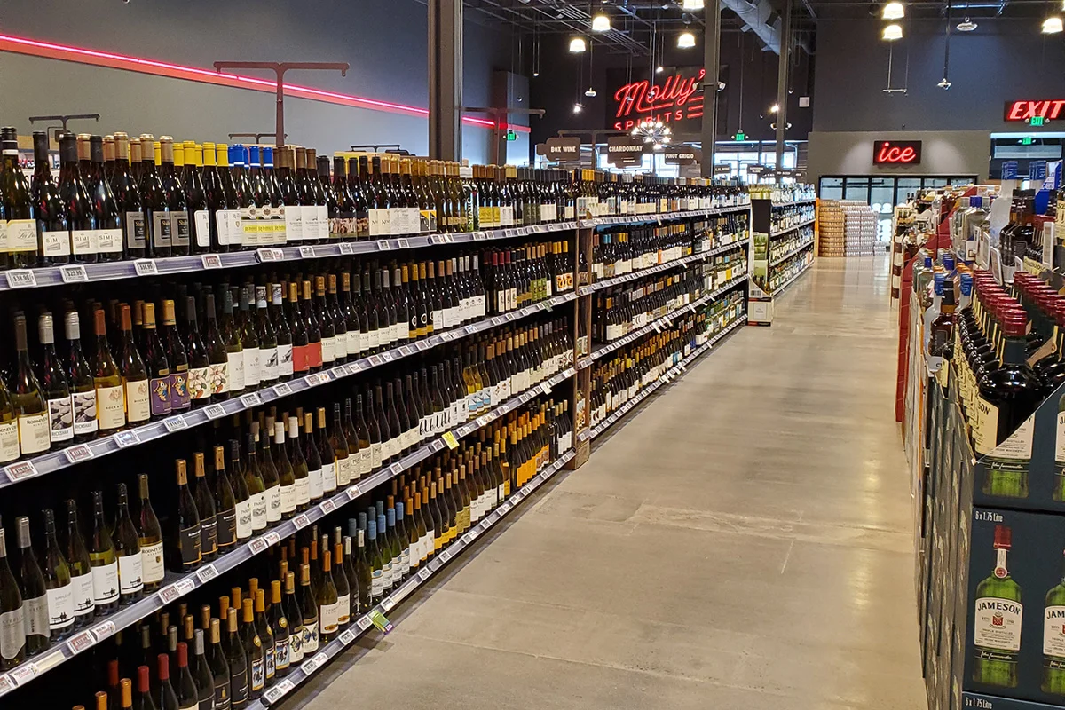 Retail grocery shelf with packaged food products and pricing labels in supermarket aisle