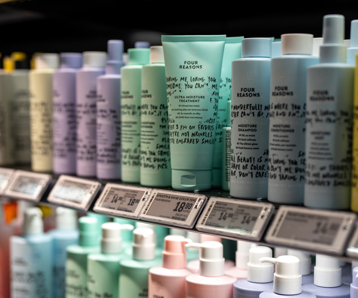 Shelf displaying Four Reasons skincare and hair care products